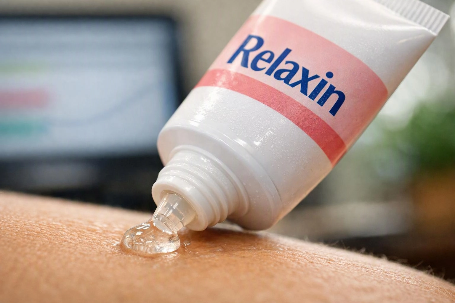 A white tube labeled Relaxin squeezes clear gel onto a person’s bare skin close up